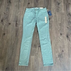 Green Universal Thread jeans.